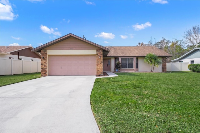 single story home with a garage and a front yard