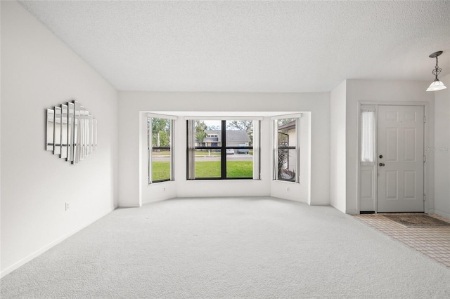 interior space featuring a textured ceiling