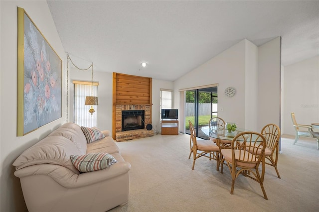 living room featuring light colored carpet, lofted ceiling, and a fireplace