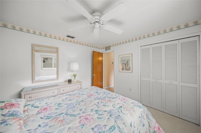 bedroom featuring light carpet, a closet, and ceiling fan