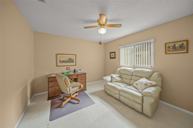 interior space with carpet, ceiling fan, and a textured ceiling