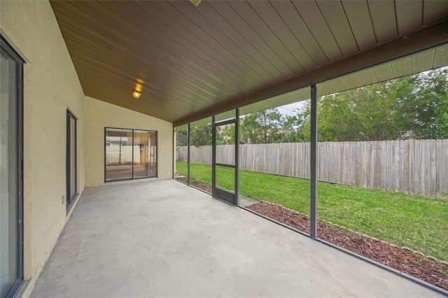 unfurnished sunroom with wood ceiling and lofted ceiling