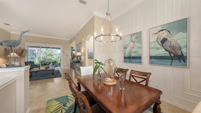 tiled dining area featuring vaulted ceiling, ornamental molding, and a chandelier