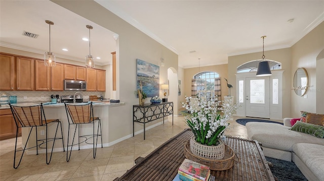 tiled living room featuring crown molding