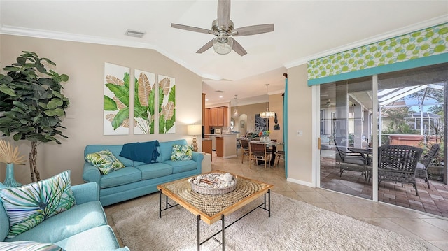 tiled living room with ceiling fan, crown molding, and lofted ceiling