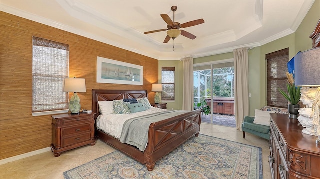 tiled bedroom with wooden walls, access to outside, a raised ceiling, ceiling fan, and ornamental molding