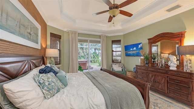 bedroom with a raised ceiling, ceiling fan, access to outside, and ornamental molding