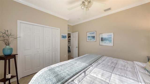 bedroom with a closet, ceiling fan, and ornamental molding