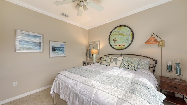 carpeted bedroom with ceiling fan and crown molding