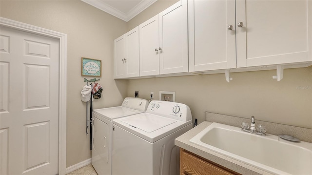 washroom featuring cabinets, washing machine and dryer, light tile patterned floors, ornamental molding, and sink