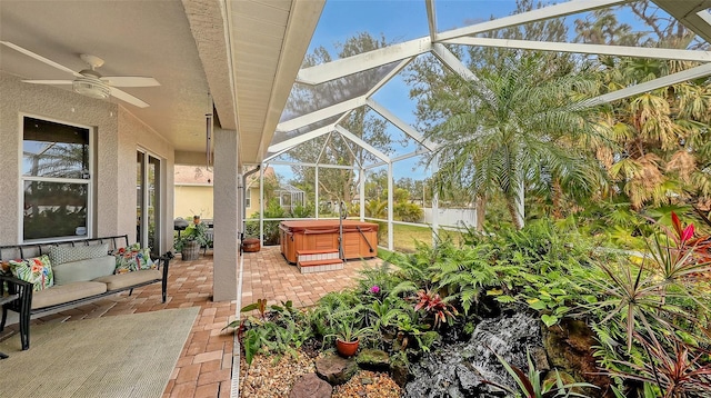 sunroom / solarium featuring ceiling fan