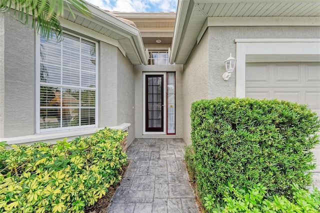 doorway to property featuring a garage