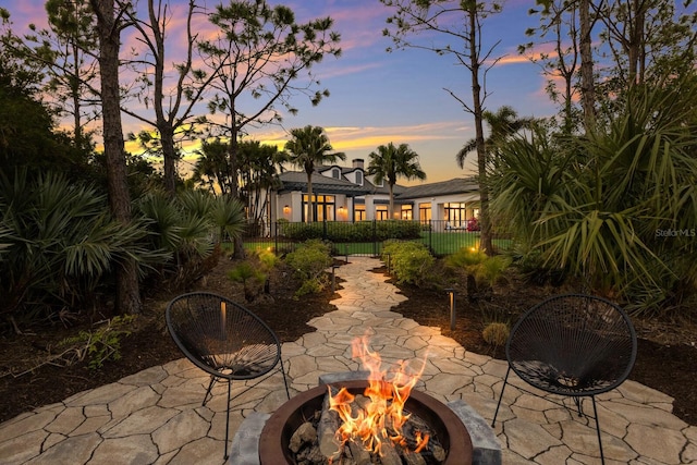 patio terrace at dusk with an outdoor fire pit