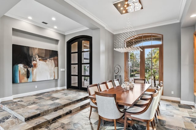 dining space featuring french doors, a chandelier, and ornamental molding