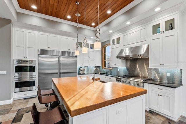 kitchen with exhaust hood, an island with sink, and wood ceiling