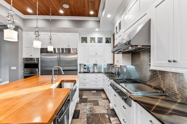 kitchen featuring white cabinets, wood ceiling, hanging light fixtures, and appliances with stainless steel finishes