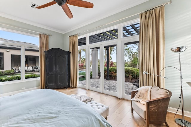 bedroom featuring crown molding, access to exterior, light hardwood / wood-style flooring, and ceiling fan