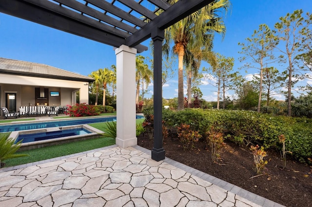 view of patio with a bar, a swimming pool with hot tub, and a pergola