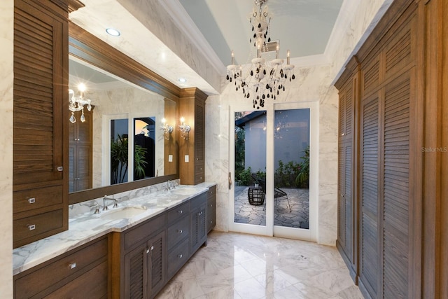 bathroom featuring vanity, an inviting chandelier, and crown molding