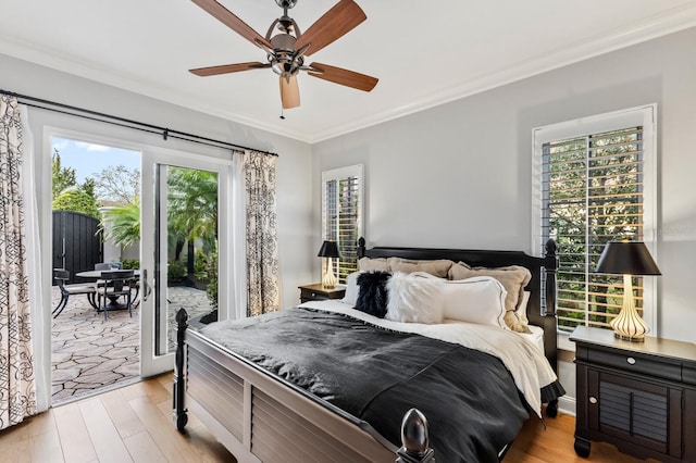 bedroom featuring light wood-type flooring, ceiling fan, ornamental molding, and access to outside