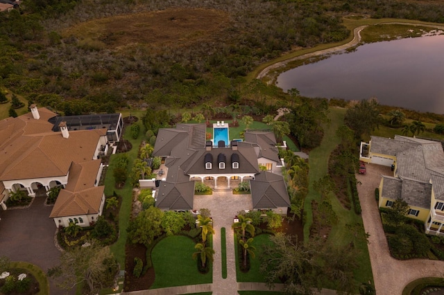 birds eye view of property with a water view