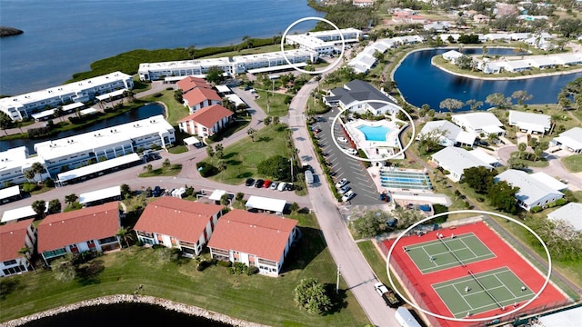 birds eye view of property with a water view