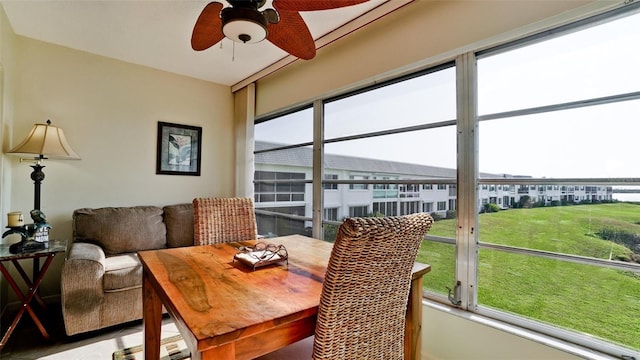 sunroom / solarium with ceiling fan and a healthy amount of sunlight