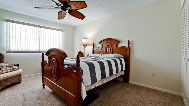 carpeted bedroom featuring a textured ceiling and ceiling fan