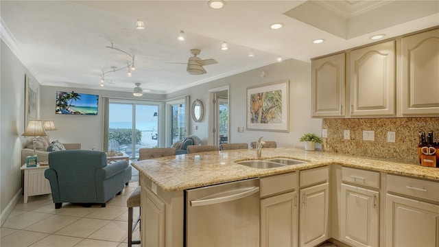 kitchen with stainless steel dishwasher, a sink, crown molding, light tile patterned floors, and a peninsula