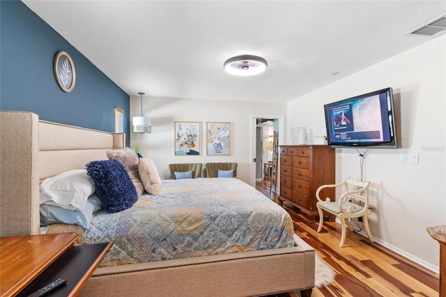 bedroom featuring hardwood / wood-style floors