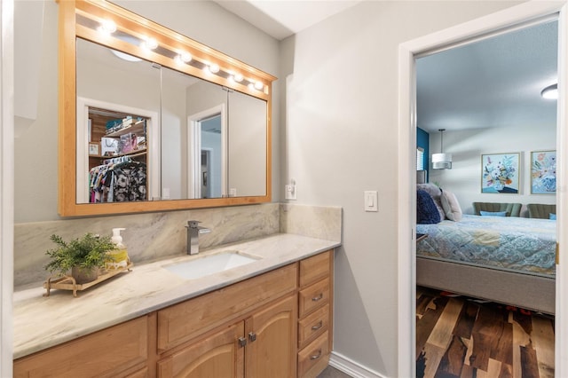 bathroom featuring wood-type flooring and vanity