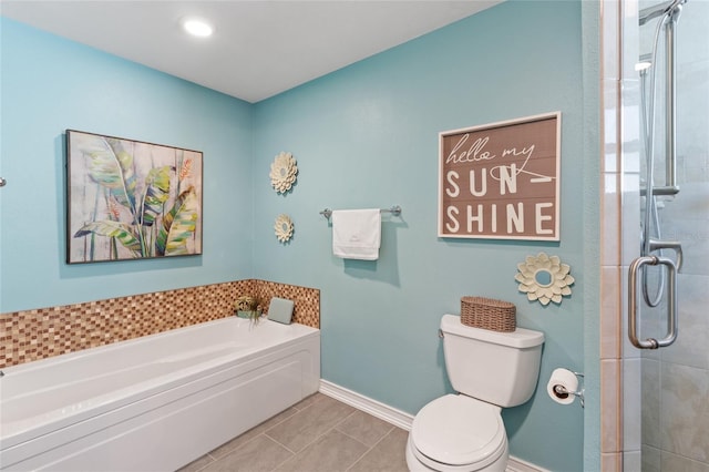 bathroom featuring tile patterned flooring, toilet, and independent shower and bath