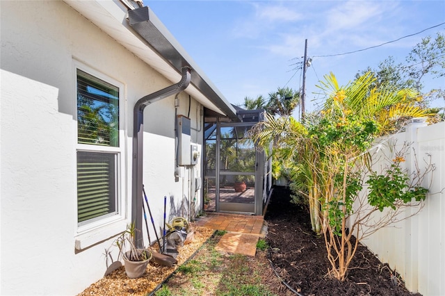 view of yard featuring glass enclosure