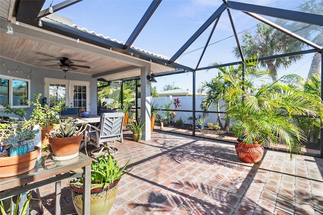 view of patio / terrace with glass enclosure and ceiling fan