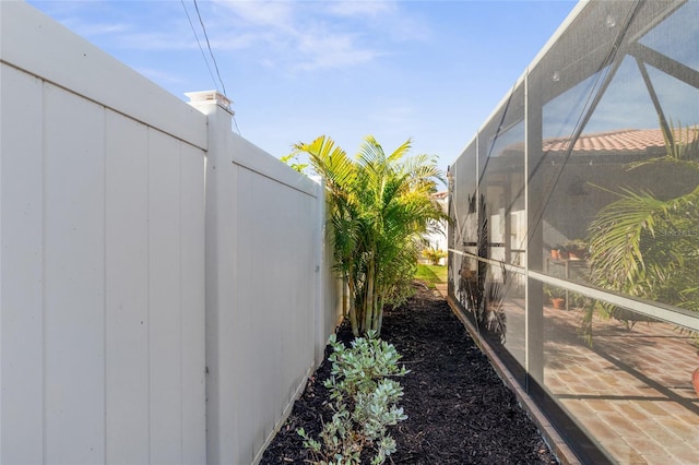 view of property exterior with a lanai