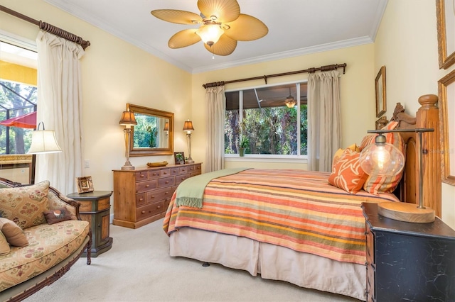 bedroom with ceiling fan, light carpet, and ornamental molding