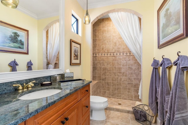 bathroom with tile patterned floors, ornamental molding, vanity, toilet, and curtained shower