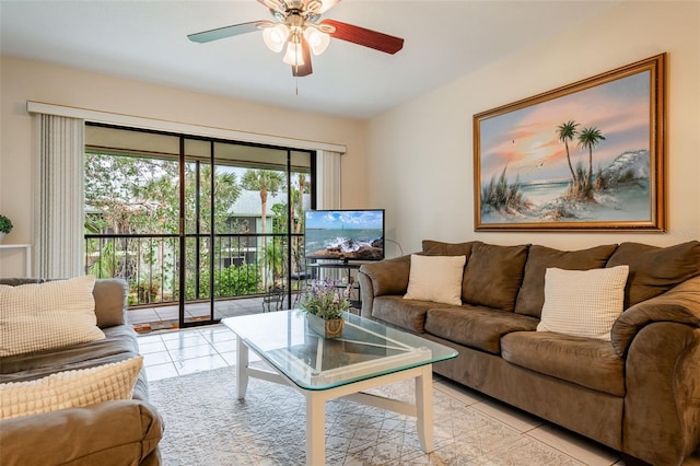 tiled living room with plenty of natural light and ceiling fan