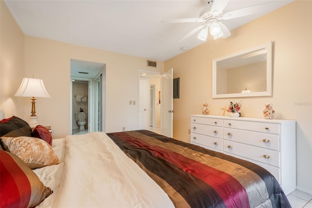 bedroom featuring ensuite bath, ceiling fan, and light tile patterned flooring