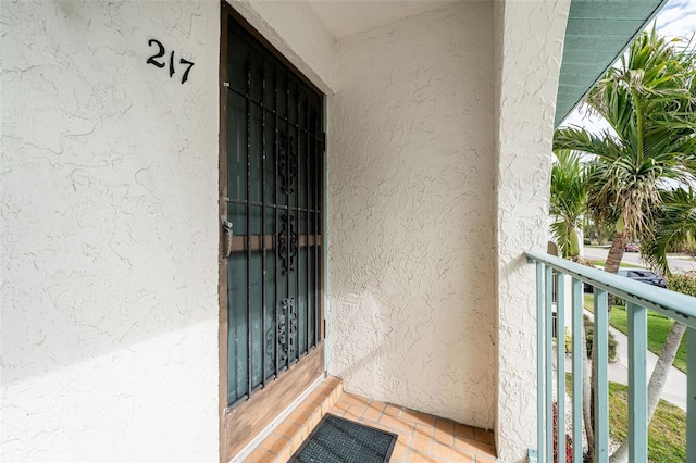 property entrance with a balcony