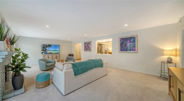 carpeted living room with a fireplace