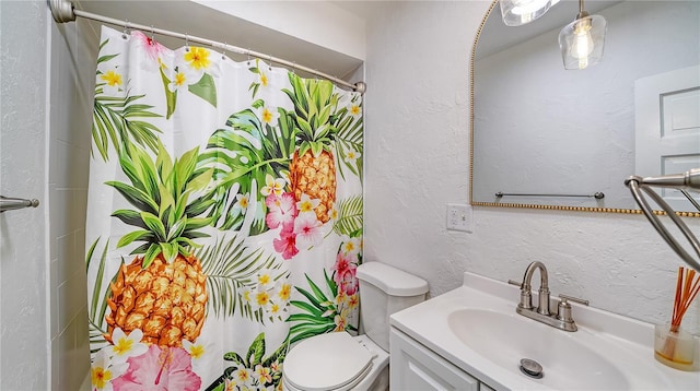 bathroom with vanity, a shower with curtain, and toilet