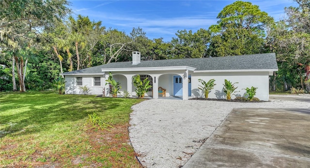 single story home with a front yard