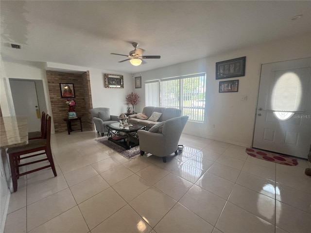 tiled living room with ceiling fan