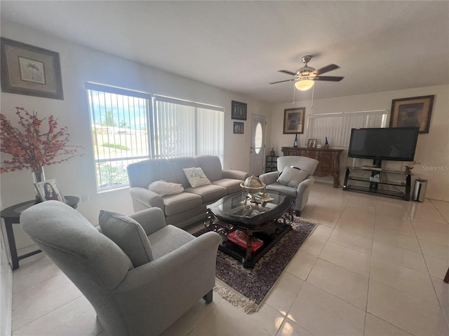 tiled living room with ceiling fan