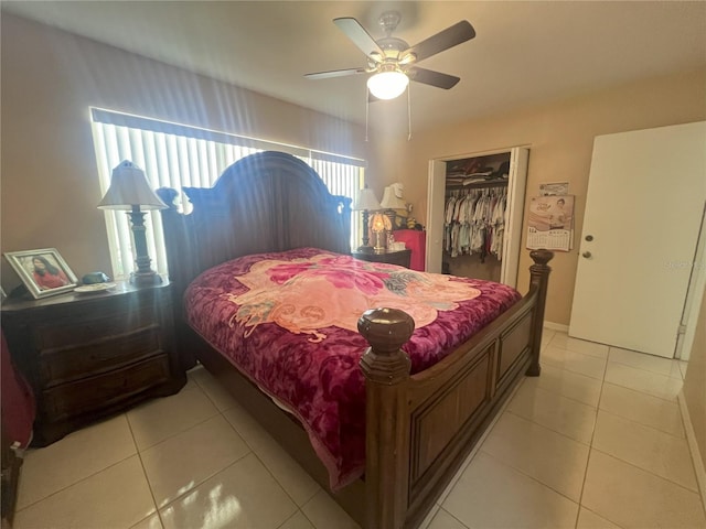 bedroom featuring a walk in closet, ceiling fan, a closet, and light tile patterned floors