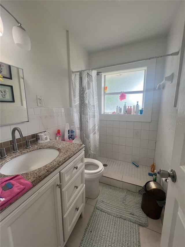 bathroom featuring curtained shower, tile patterned flooring, decorative backsplash, vanity, and tile walls