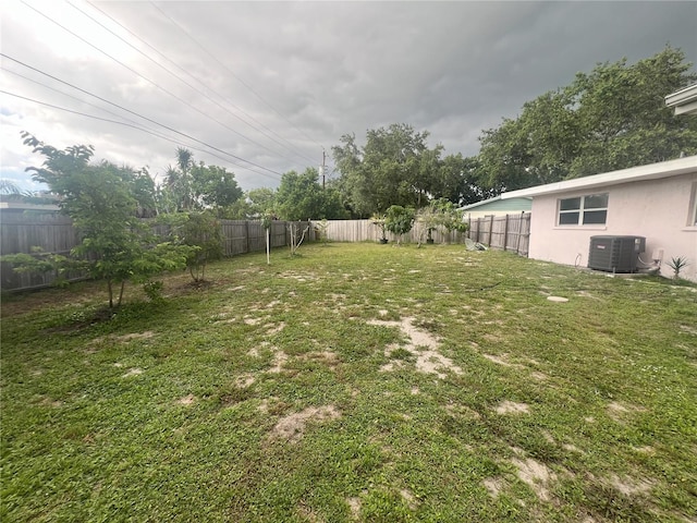 view of yard featuring central air condition unit