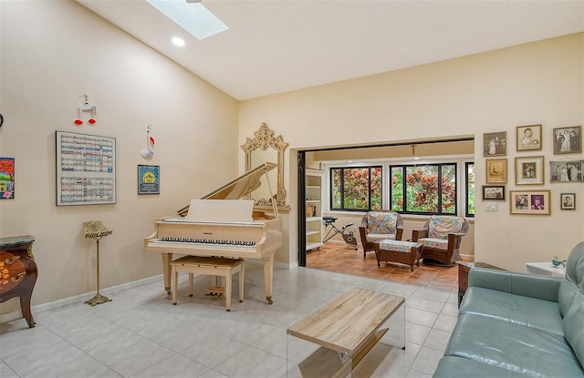 tiled living room featuring lofted ceiling with skylight