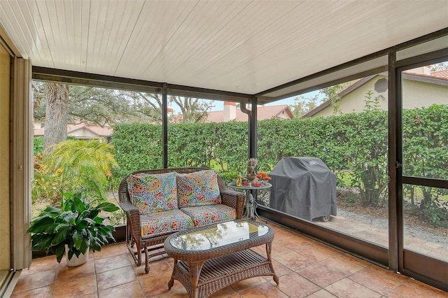 sunroom / solarium featuring a healthy amount of sunlight